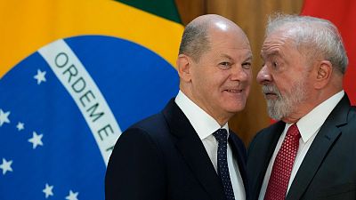 Brazil's President Luiz Inacio Lula da Silva, hight, and German Chancellor Olaf Scholz, after a press conference at Planalto Palace, in Brasilia, Brazil, Jan. 30, 2023.