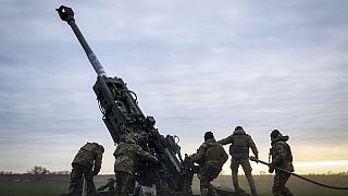 Ukrainian soldiers prepare a U.S.-supplied M777 howitzer to fire at Russian positions in Kherson region, Ukraine, Jan. 9, 2023. 
