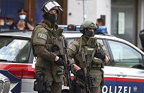 Police officers guard the scene in Vienna, Austria, Tuesday, Nov. 3, 2020