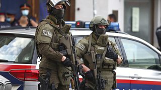 Police officers guard the scene in Vienna, Austria, Tuesday, Nov. 3, 2020