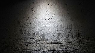  Tally marks are etched in to a wall by detainees to keep track of time in a building used, according to a war crimes prosecutor, as a place of torture in Kherson