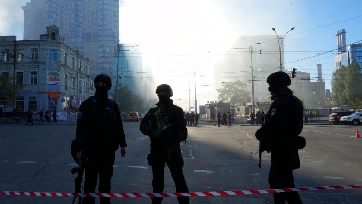 Police block a square after a drone fired on buildings in Kyiv, Ukraine, Monday, Oct. 17, 2022.