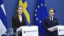 Finland's Prime Minister Sanna Marin, left, and Sweden's Prime Minister Ulf Kristersson at a press conference in Stockholm, 2 February 2022