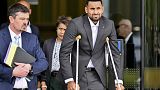 Tennis star Nick Kyrgios leaves the courtroom while on crutches in Canberra, Australia