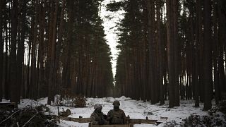 Ukrainian servicemen stand at a position close to the border with Belarus, Ukraine, Wednesday, Feb. 1, 2023. 