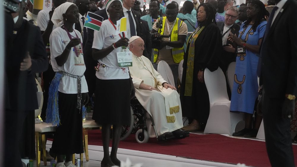 WATCH: Pope visits church in South Sudan packed with people holding up signs for peace