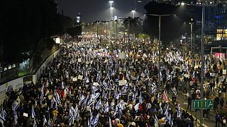 Israelis protest against the plans by Prime Minister Benjamin Netanyahu's new government to overhaul the judicial system, in Tel Aviv, Israel, Saturday, Jan. 28, 2023. 