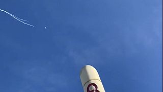 This photo provided by Jason Sellers shows US Air Force fighter aircraft shooting down a suspected Chinese spy balloon off the Carolina coast on Saturday. 