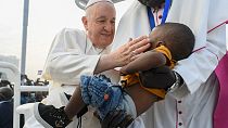 Pope Francis blessing a child during the holy mass at the John Garang Mausoleum in Juba. Feb. 5 2023