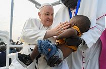 Pope Francis blessing a child during the holy mass at the John Garang Mausoleum in Juba. Feb. 5 2023
