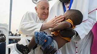 Pope Francis blessing a child during the holy mass at the John Garang Mausoleum in Juba. Feb. 5 2023