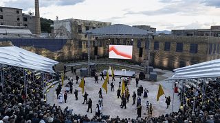 People attend a performance during the inauguration ceremony for the European capital of Culture at Elefsina town, west of Athens, Greece..