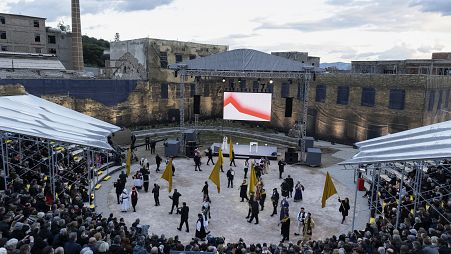 People attend a performance during the inauguration ceremony for the European capital of Culture at Elefsina town, west of Athens, Greece..