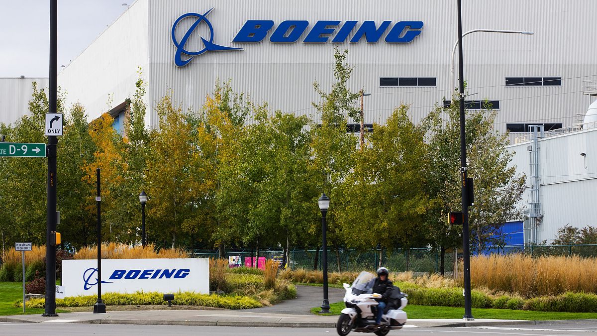A motorcyclist cruises past the Renton, Boeing plant in Washington state, where 737's are built, 28 Oct 2020