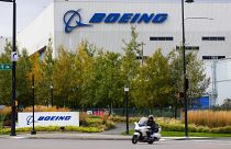 A motorcyclist cruises past the Renton, Boeing plant in Washington state, where 737's are built, 28 Oct 2020