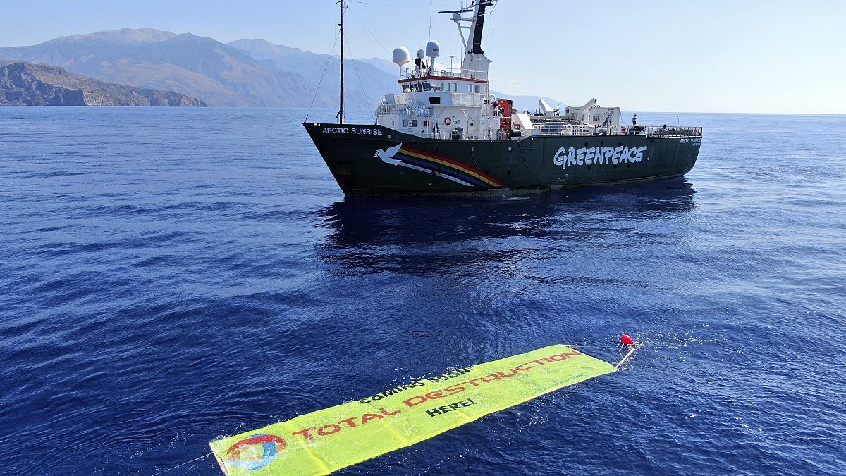 A banner against proposed deep-sea oil and gas exploration is placed by Greenpeace near its vessel Arctic Sunrise southwest of Crete, Greece, Monday, 30 August.