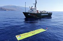A banner against proposed deep-sea oil and gas exploration is placed by Greenpeace near its vessel Arctic Sunrise southwest of Crete, Greece, Monday, 30 August.