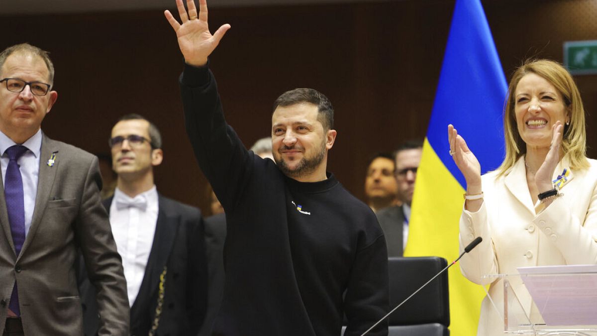 Ukraine's President Volodymyr Zelenskyy, centre, gestures during an EU summit at the European Parliament in Brussels, Belgium, Thursday, Feb. 9, 2023