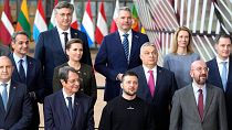 Ukraine's President Volodymyr Zelenskyy, center front, poses with European Union leaders during a group photo at an EU summit in Brussels on Feb. 9, 2023.