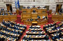 FILE: Greek Prime Minister Kyriakos Mitsotakis speaks during a parliament session, 17 December 2022
