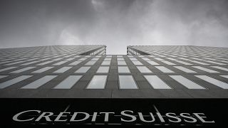 FILE - Grey clouds cover the sky over a building of the Credit Suisse bank in Zurich, Switzerland, Feb. 21, 2022.