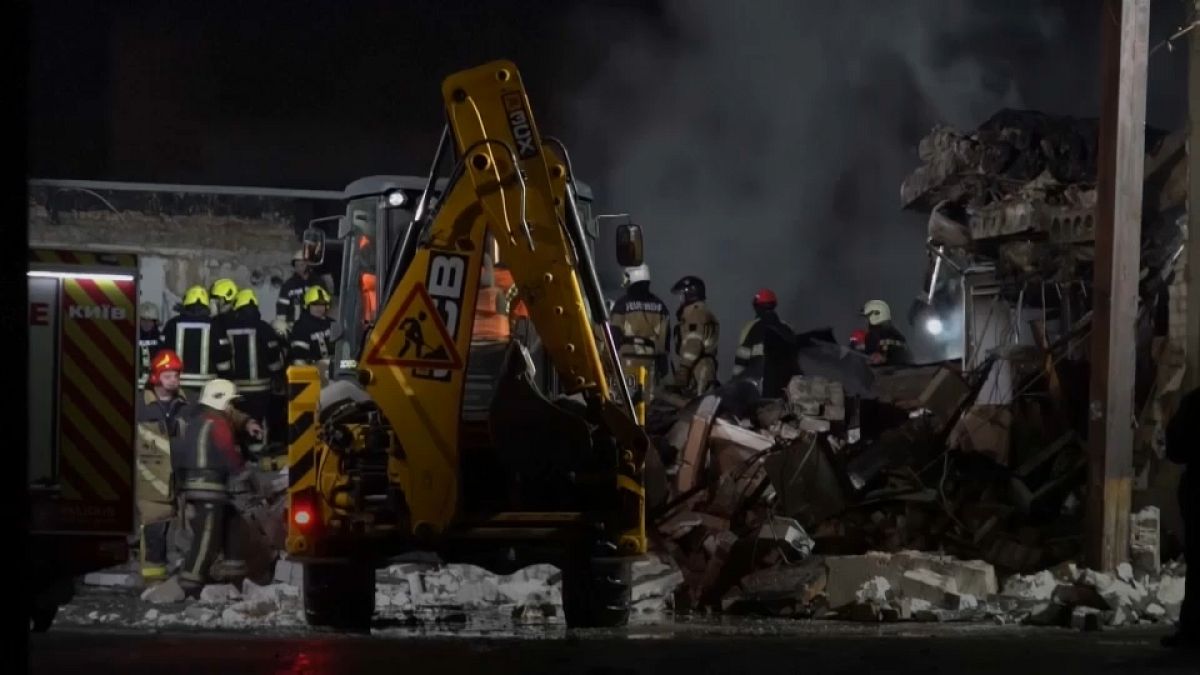 Bulldozer clearing rubble and debris after an explosion in Kyiv. 