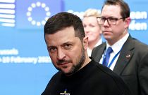 Ukraine's President Volodymyr Zelenskyy, left, leaves after meeting European Union leaders at an EU summit in Brussels on Thursday, Feb. 9, 2023.