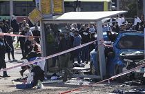 A car crashed into a bus stop killing two people including a child.