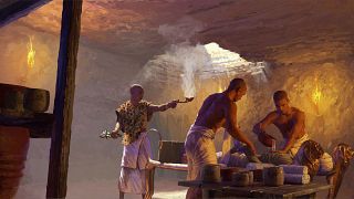 This illustratio depicts a priest during an embalming process in an underground chamber in Saqqara, Egypt.