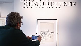 الغلاف الأمامي الأصلي لـ ""تان تان في أمريكا" في دار مزاد "آر كوريال" ي بروكسل، قبل المزاد العلني في باريس-