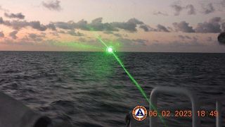 This photo provided by the Philippine Coast Guard shows a green military-grade laser light from a Chinese coast guard ship in the disputed South China Sea.