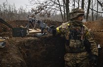 An Ukrainian soldier stands on duty with his machine gun at an undisclosed location in Donetsk region, Ukraine, Wednesday, Nov. 16, 2022.