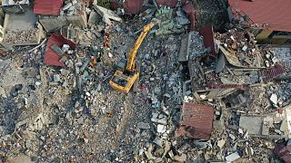 FILE: Rescue workers continue to clear rubble in the search for the missing, in Antakya, Turkey, Saturday, Feb. 11, 2023