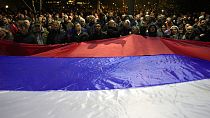 A Russian flag is unfurled at the far-right protest in Belgrade over the government's policy toward Kosovo on February 15.