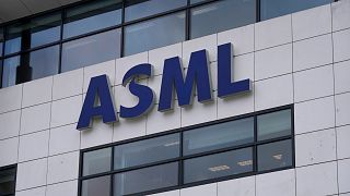 The logo of ASML, a leading maker of semiconductor production equipment, hangs on the head office in Veldhoven, Netherlands