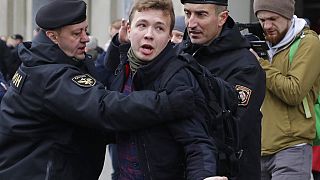 Belarus police arrest journalist Raman Pratasevich, center, in Minsk, Belarus 26 March, 2017