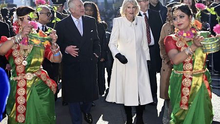 Britain's King Charles III and Camilla, the Queen Consort visit Brick Lane in east London, Wednesday Feb. 8, 2023