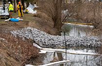 Cleanup continues in a stream in East Palestine Park in East Palestine, Ohio