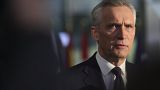 NATO Secretary General Jens Stoltenberg speaks as he arrives for a NATO defense ministers meeting at NATO headquarters in Brussels, Tuesday, Feb. 14, 2023.