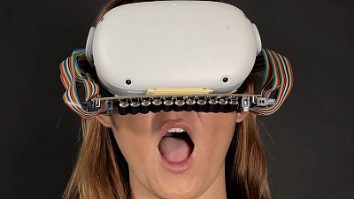 Researchers have developed a VR headset that sends taps and vibrations to the mouth to enhance haptic sensations like the feeling of rain, wind or smoke.