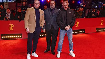 Producer Billy Smith, from left, directors Aaron Kaufman and Sean Penn pose for photographers at the premiere for the film 'Superpower'
