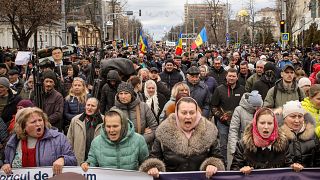 People march during a protest initiated by Moldova's recently-formed Movement for the People group, and supported by members of Moldova's Russia-friendly Shor Party.