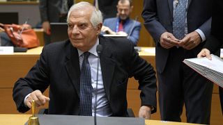 European Union foreign policy chief Josep Borrell rings a bell to signify the start of a meeting of EU foreign ministers at the European Council building in Brussels on 20 Feb