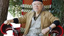FILE - Manga artist Leiji Matsumoto poses for portraits at the 70th edition of the Venice Film Festival held from Aug. 28 through Sept. 7, in Venice, Italy, on Sept. 3, 2013.
