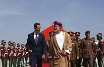 Omani Sultan Haitham bin Tariq, centre right, receives Syrian President Bashar Assad, centre left, on arrival in Muscat, Feb 20, 2023