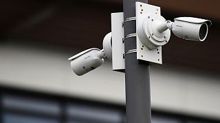 This picture taken on January 21, 2022 shows video surveillance cameras in a private parking in Gouesnou, western France.