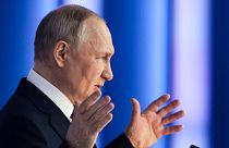 Russian President Vladimir Putin gestures as he gives his annual state of the nation address in Moscow, Russia, Tuesday, Feb. 21, 2023. 