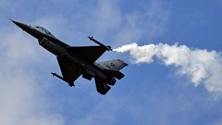 A US Air Force Lockheed Martin F-16 Fighting Falcon fighter plane flies over during a flight display in England, 2008.