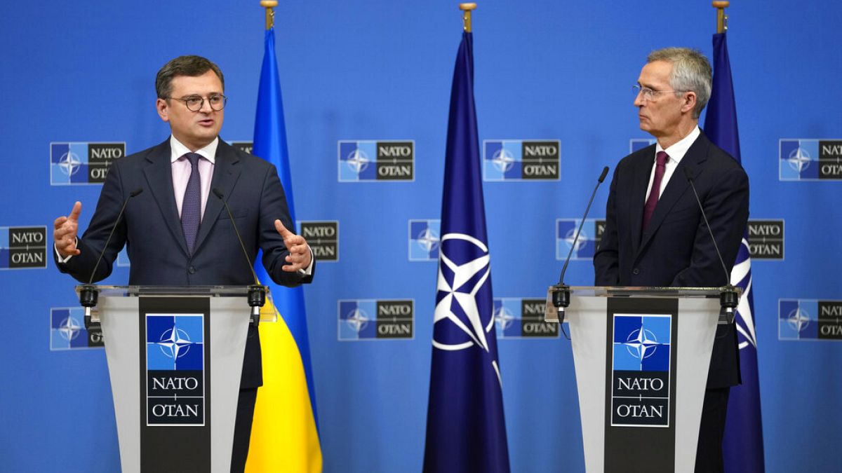 Ukraine's Foreign Minister Dmytro Kuleba, left, and NATO Secretary General Jens Stoltenberg address a media conference at NATO headquarters in Brussels, Tuesday, Feb. 21, 2023
