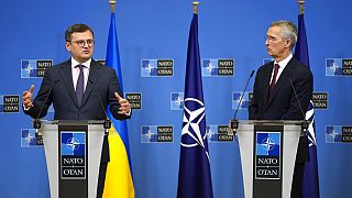 Ukraine's Foreign Minister Dmytro Kuleba, left, and NATO Secretary General Jens Stoltenberg address a media conference at NATO headquarters in Brussels, Tuesday, Feb. 21, 2023
